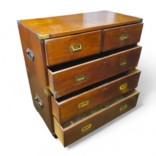 351 - A mid Victorian mahogany campaign chest of drawers, two short above three long, each inset recessed ... 