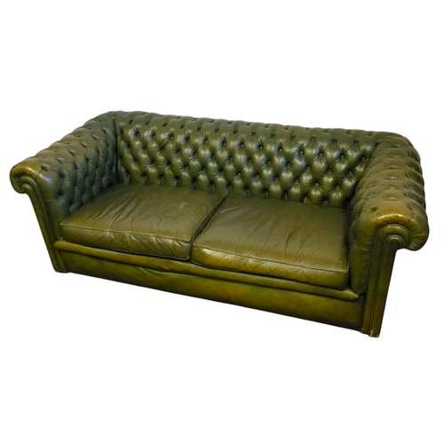 332 - An olive green leather Chesterfield sofa, 65cm x 185cm x 84cm