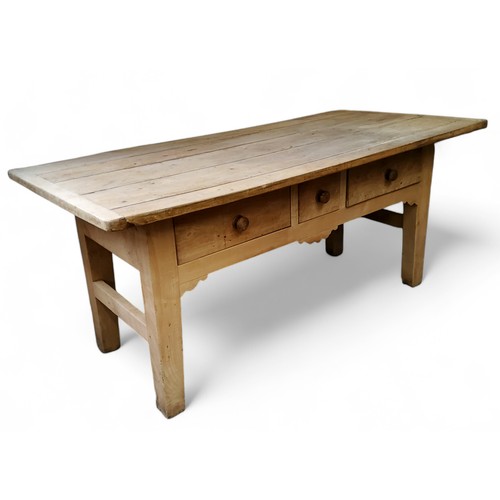 643 - A 19th century French 'Chateau' chestnut farmhouse table, plank top, two long and one short drawer t... 