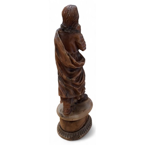 418 - An 18th century Flemish alabaster figure, of a saint praying, oval pedestal, 21.5cm high