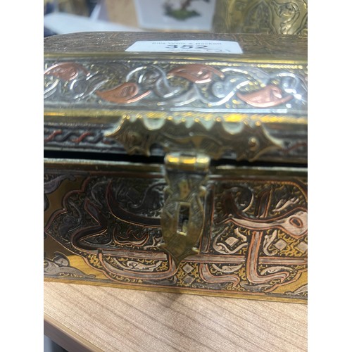 352 - A Middle Eastern canted rectangular silver and copper damascened brass casket, decorated in the Cair... 