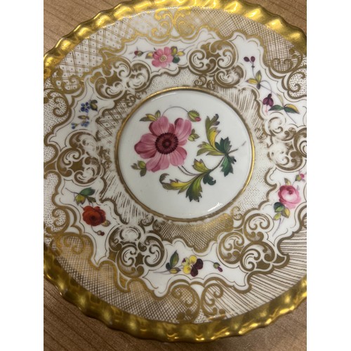 145 - A Chamberlains coffee cup and saucer, painted with flowers on an intricate gilt ground, printed lion... 