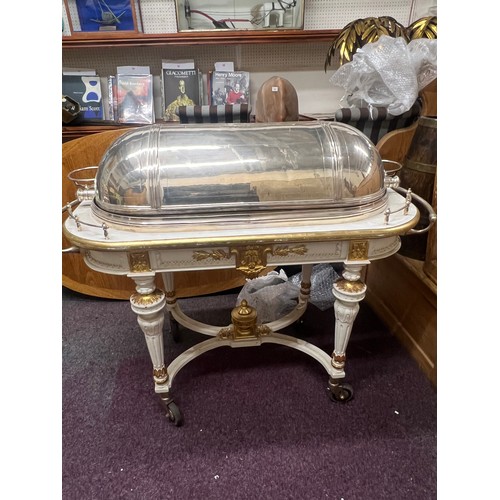 633 - A large and impressive E.P.N.S. meat carving trolley, domed retracting cover engraved with oval cart... 