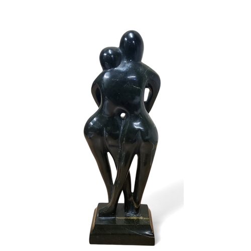 9 - Manner of Henry Moore, carved granite sculpture 'Embrace', 32cm high