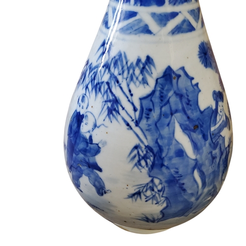 47 - A Chinese bottle vase, underglaze blue and white decorated with playful scenes of hide and seek and ... 