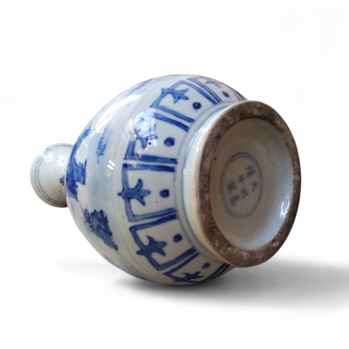 47 - A Chinese bottle vase, underglaze blue and white decorated with playful scenes of hide and seek and ... 