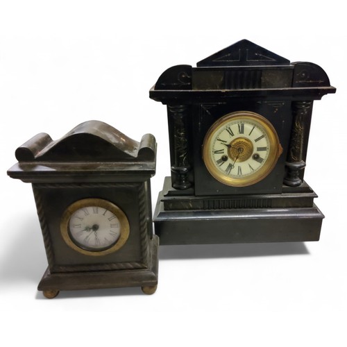 125 - A 19th century German mantel clock. in faux slate, Roman numerals, twin winding holes, 14 day strike... 