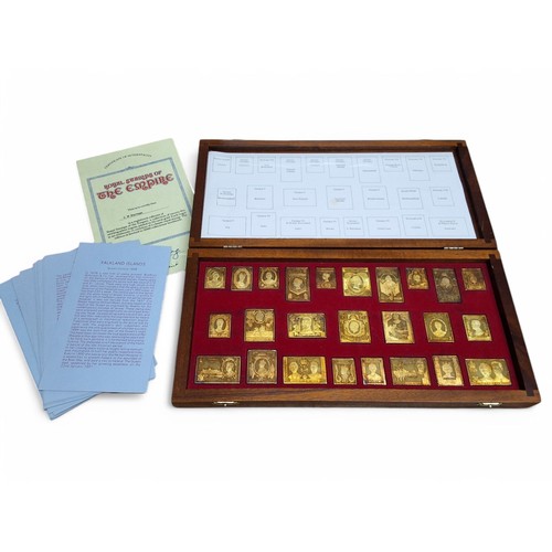 206 - A Danbury Mint Royal Stamps of the Empire, twenty five silver ingots plated in 22ct gold in the form... 