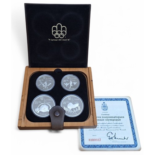 219 - A Canada Royal 1976 Olympic Coin Proof Set, series 4, 925, 145.8g, COA, leather and wood presentatio... 