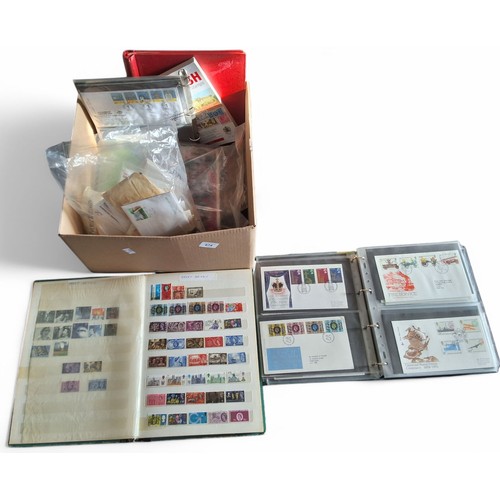 674 - Stamps- A collection of GB mint and used stamps and FDC's. Includes a large stock book of mainly com... 