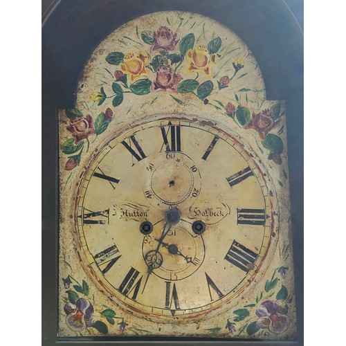 427 - An early 19th century flamed mahogany longcase clock by J. Hutton of Holbeck, the painted arched ena... 