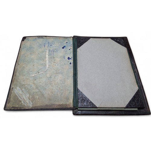 Militaria - a embossed leather desk blotter folder, centrally mounted ...