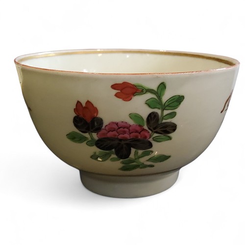 67 - A Worcester Thunder and Lightening pattern tea bowl and saucer, painted with stylised floral stem di... 