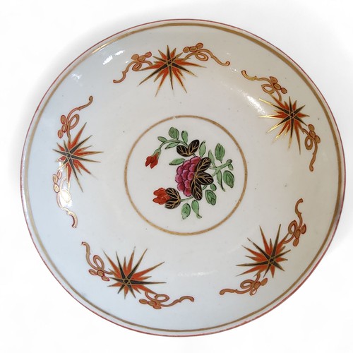 67 - A Worcester Thunder and Lightening pattern tea bowl and saucer, painted with stylised floral stem di... 