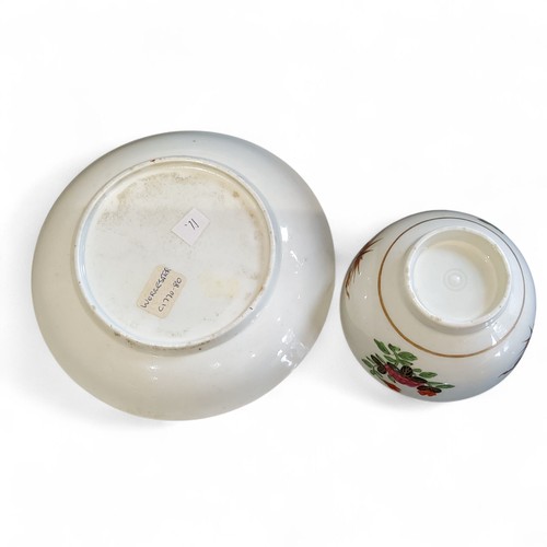 67 - A Worcester Thunder and Lightening pattern tea bowl and saucer, painted with stylised floral stem di... 