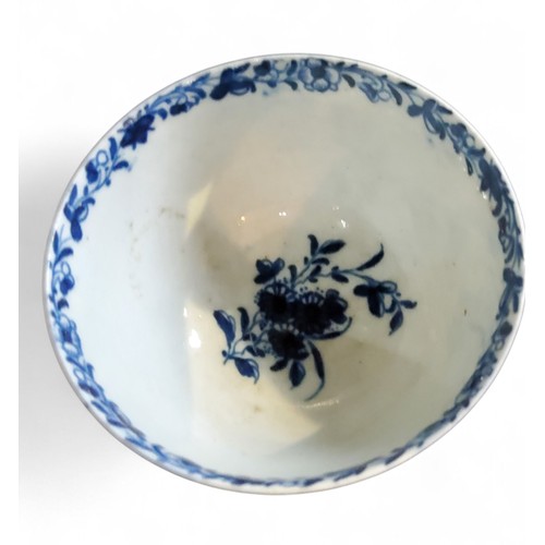 69 - A Worcester Feather Moulded Floral pattern tea bowl and saucer, painted in cobalt blue with trailing... 