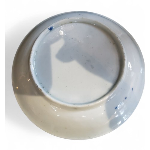 69 - A Worcester Feather Moulded Floral pattern tea bowl and saucer, painted in cobalt blue with trailing... 