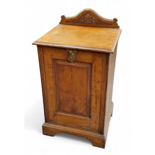 191 - A late 19th century oak purdonium, shaped cresting, fall front panelled door, bracket feet, 85cm hig... 