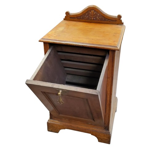 191 - A late 19th century oak purdonium, shaped cresting, fall front panelled door, bracket feet, 85cm hig... 