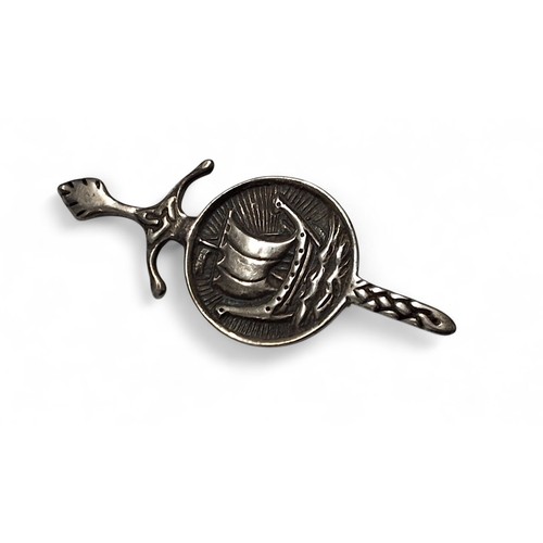 225 - A Scottish silver brooch/kilt pin in the form of a Iona Celtic sword and Viking ship, Iain MacCormic... 