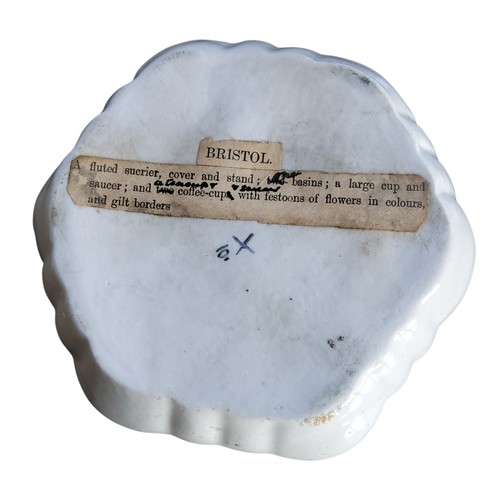 31 - A Bristol shaped circular stand, , decorated with festoons of flowers, in colours, gilt dentil borde... 