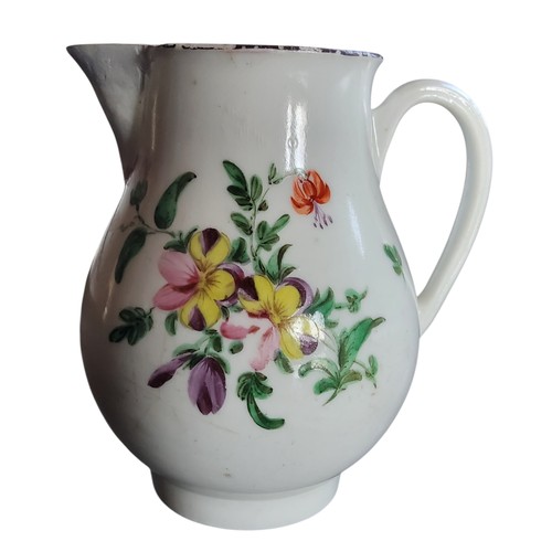 32 - A Bristol sparrow beak jug, decorated with a spray of colourful summer flowers, brown rim, 9.5cm hig... 