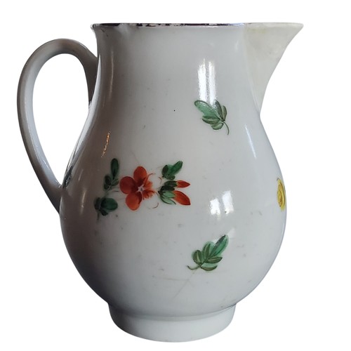 32 - A Bristol sparrow beak jug, decorated with a spray of colourful summer flowers, brown rim, 9.5cm hig... 