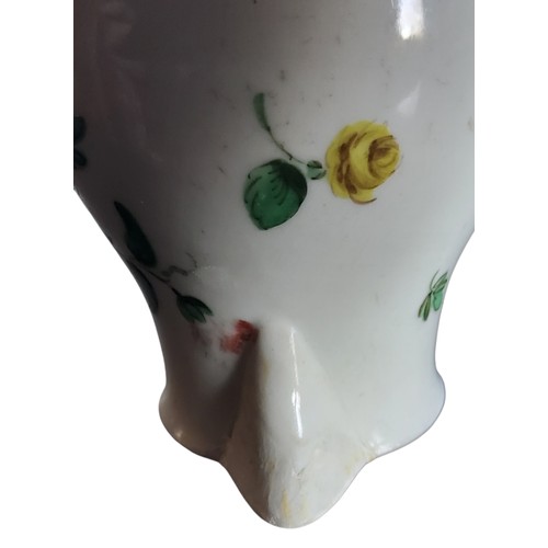32 - A Bristol sparrow beak jug, decorated with a spray of colourful summer flowers, brown rim, 9.5cm hig... 