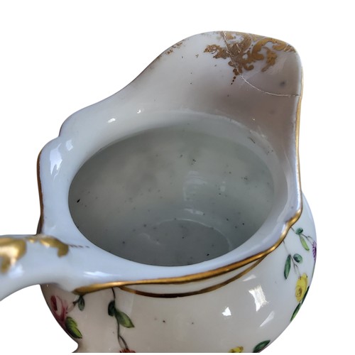 38 - A Bristol ogee milk jug, decorated with festoons of flowers, in colours, gilt dentil border, double ... 