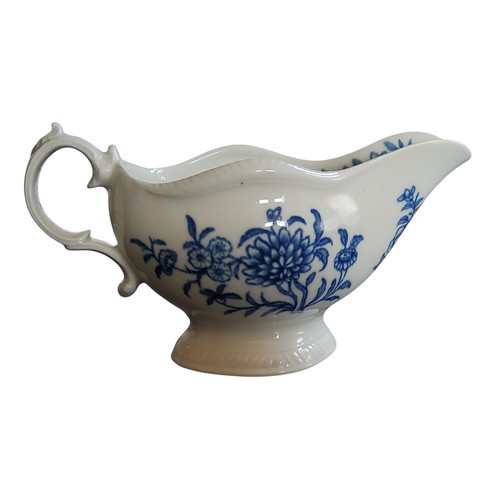 27 - A Worcester sauceboat, decorated with The Early Flowering Plant pattern, shaped gadrooned rim, scrol... 