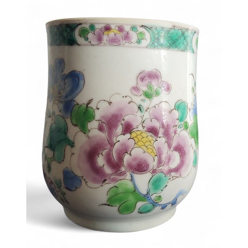 51 - A Bow bell shaped polychrome mug, grooved loop handle and heart-shaped lower terminal, painted with ... 