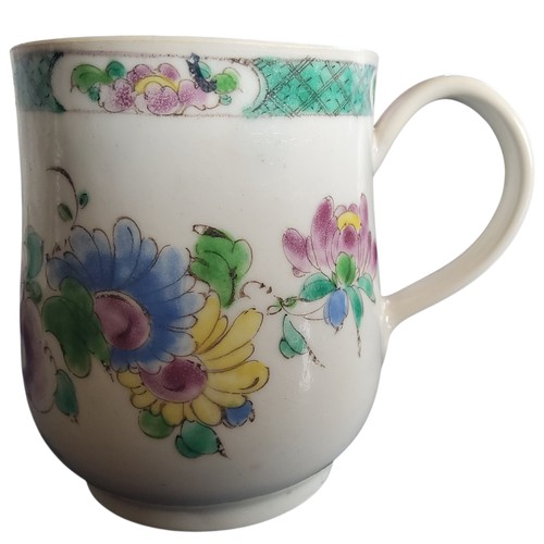 51 - A Bow bell shaped polychrome mug, grooved loop handle and heart-shaped lower terminal, painted with ... 