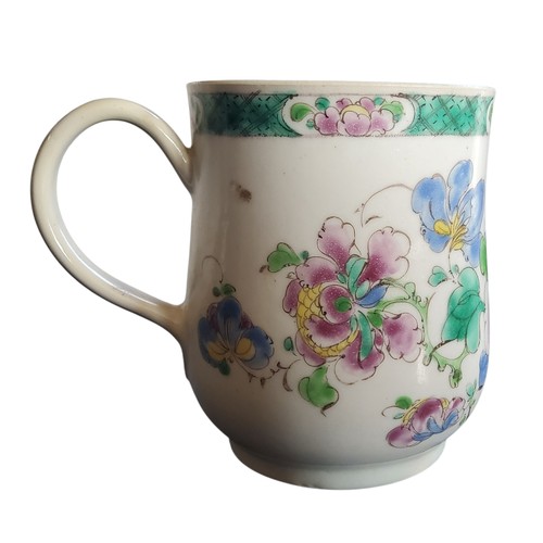 51 - A Bow bell shaped polychrome mug, grooved loop handle and heart-shaped lower terminal, painted with ... 