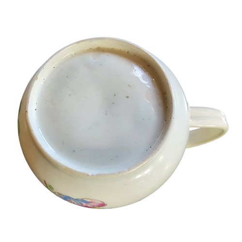 51 - A Bow bell shaped polychrome mug, grooved loop handle and heart-shaped lower terminal, painted with ... 