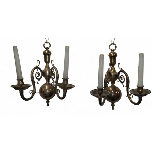 13 - A pair of brass two-light wall sconces, leafy scroll arms, globular back plates, 44.5cm high, cast L... 