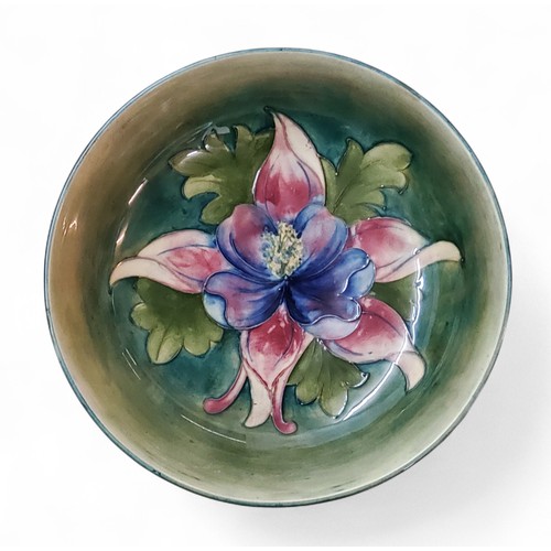 5 - A Moorcroft Orchid pattern bowl,&nbsp; tube lined with large flowerhead and foliage in tones of red,... 