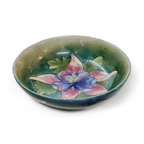 5 - A Moorcroft Orchid pattern bowl,&nbsp; tube lined with large flowerhead and foliage in tones of red,... 