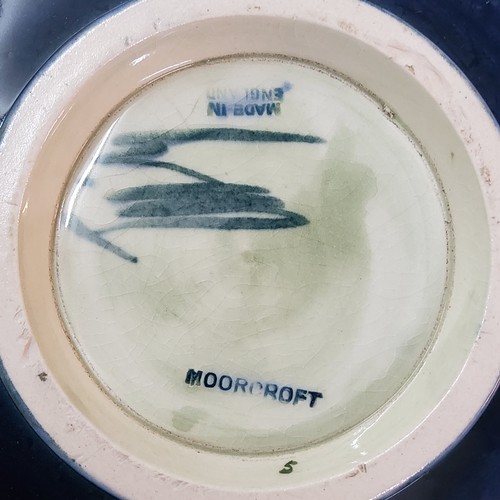 5 - A Moorcroft Orchid pattern bowl,&nbsp; tube lined with large flowerhead and foliage in tones of red,... 