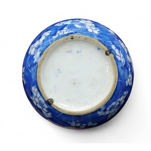 6 - A pair of Chinese bottle vases, painted in tones of underglaze blue with blossoming prunus on a&nbsp... 