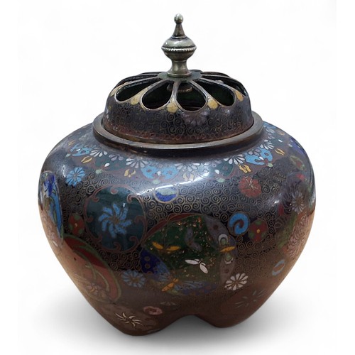 10 - A Japanese ovoid cloisonne pot pourri vase, pierced cover, inlaid in colours and gilt with mons, flo... 