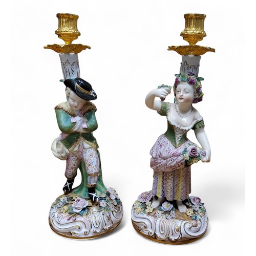 44 - A pair of 19th century figural candlesticks, in the manner of Derby, allegorical of the seasons, Aut... 