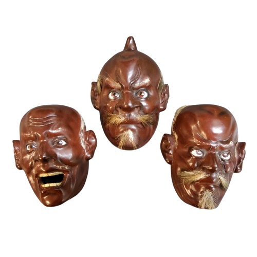 54 - Three Japanese lacquered Noh masks, the&nbsp;iki-ningyo masks with bushy hair eyebrows and moustache... 