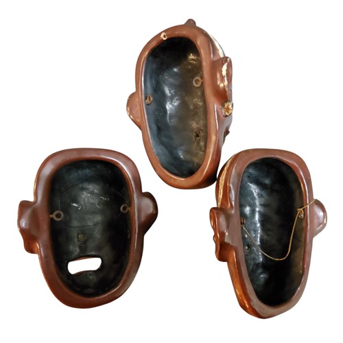 54 - Three Japanese lacquered Noh masks, the&nbsp;iki-ningyo masks with bushy hair eyebrows and moustache... 