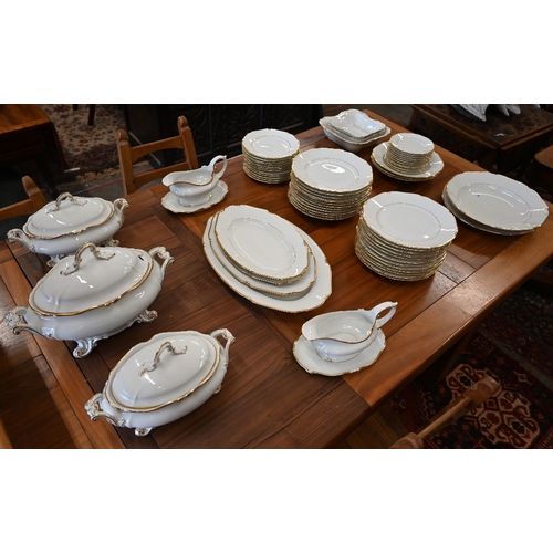 4 - A Thomas (Bavaria) dinner service with gilt rims, for twelve settings, to/w soup tureen, vegetable t... 