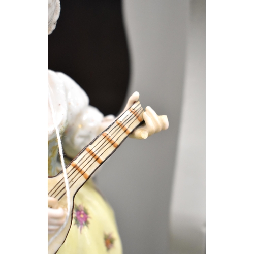 103 - A pair of late 19th century German porcelain figures, 18th century man with flute and lady with lute... 