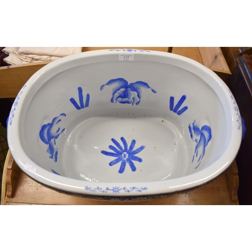 117 - A large Chinese porcelain footbath, the interior painted with blue and white fish, the exterior enam... 