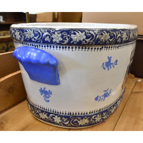 117 - A large Chinese porcelain footbath, the interior painted with blue and white fish, the exterior enam... 