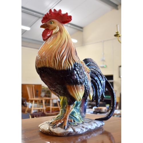 139 - A large Italian glazed pottery cockerel, 51 cm high