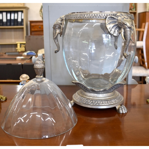 143 - A large ovoid glass bowl and cover with pewter mounts featuring elephants, 50 cm high to/w a pair of... 