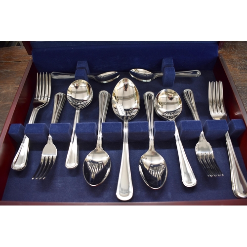 164 - A canteen of Amefa 'bead' pattern stainless steel flatware and cutlery, apparently unused